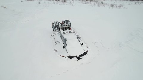 Snow-covered Hovercraft on the banks of the Ob River. Russia. Yamal.