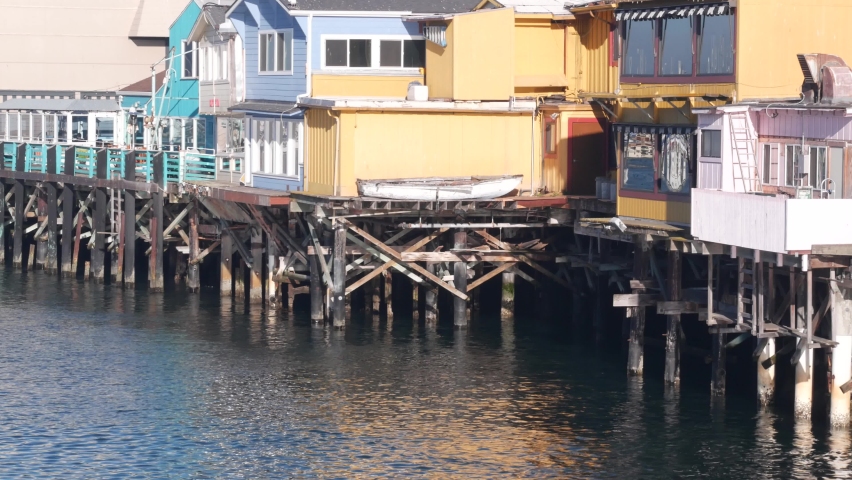 Colorful wooden houses on piles, pillars or pylons, ocean sea water, historic Old Fisherman