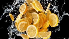 Super slow motion shot of rotating exploded lemon slices with splashing water on black at 1000fps. - Powered by Shutterstock - Get 15% off with code: PIKWIZARD15
