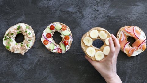 Grabbing a Peanut Butter and Banana Bagels from a Variety of Bagels