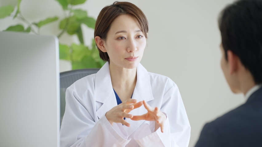 A young Asian woman doctor Royalty-Free Stock Footage #1087991687