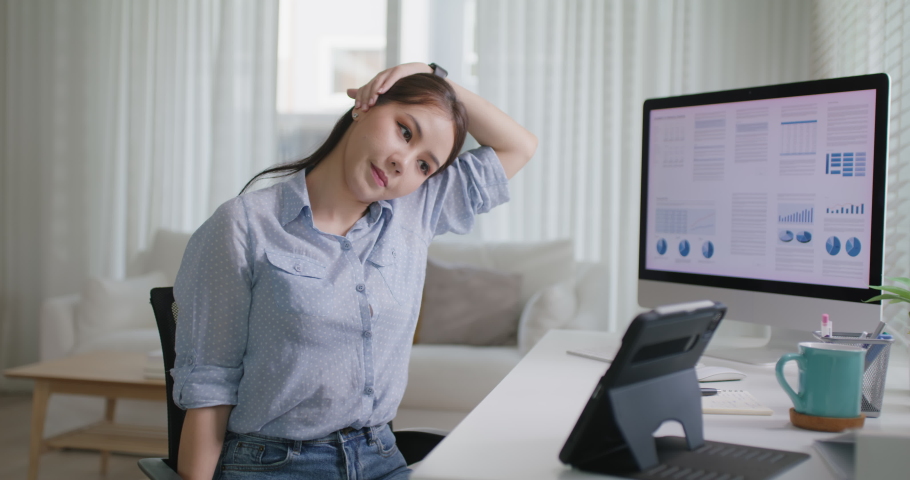 Asia people young woman worker work at home job video call telemedicine online clinic app for workforce care meet chat or tele consult to doctor remote advice teach to relax stiff neck or wrist pain. | Shutterstock HD Video #1087993695