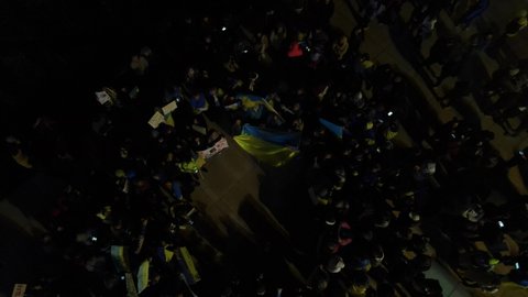Ukrainian people protest at Tel aviv against the war and against Russian leader Putin. war in Ukraine. people with placards, flags Israel, Tel aviv, march 2022