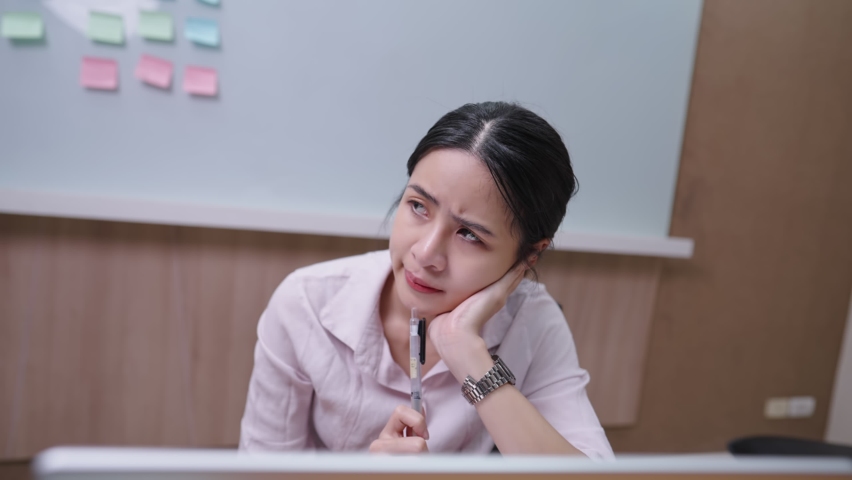 Thoughtful asian working woman work with laptop computer, thinking solving problem at working office, searching for inspiration in work life, making decision, lack of ideas creativity thought