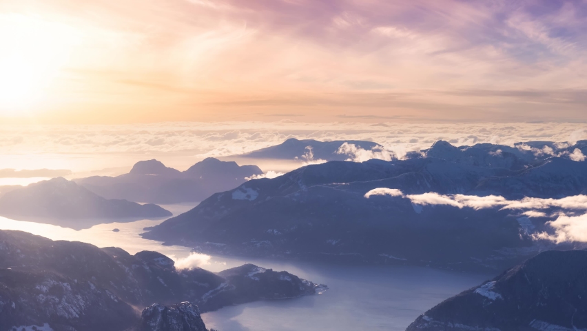 Cinemagraph Loop Animation. Aerial Panoramic View of Canadian Mountain. Winter Season Dramatic Sunset Art Render. Located near Squamish, North of Vancouver, British Columbia, Canada.