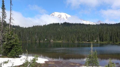 The summit of Mount Rainier with surrounding landscape