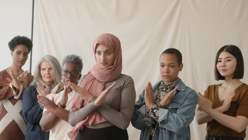 Slow motion handheld of multiethnic women gesturing Break The Bias in support of International Women's Day | Shutterstock HD Video #1088004827