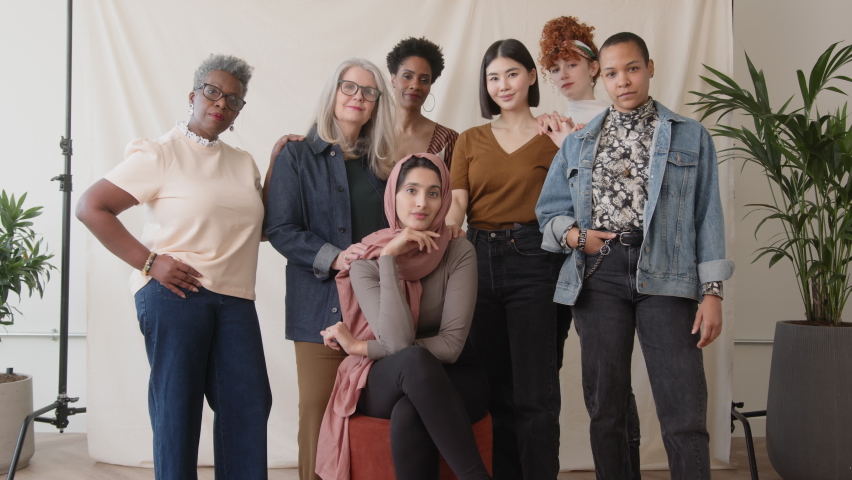 Slow motion dolly in of confident multiethnic women looking at camera and smiling in celebration of International Women's Day | Shutterstock HD Video #1088004831