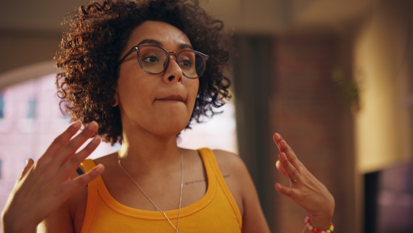 Portrait of Multiethnic Young Black Female Dancing in Comfy Casual Clothes, Having Fun at Home in Loft Apartment. Recording Funny Viral Videos for Social Media. Close Up Slow Motion Shot.