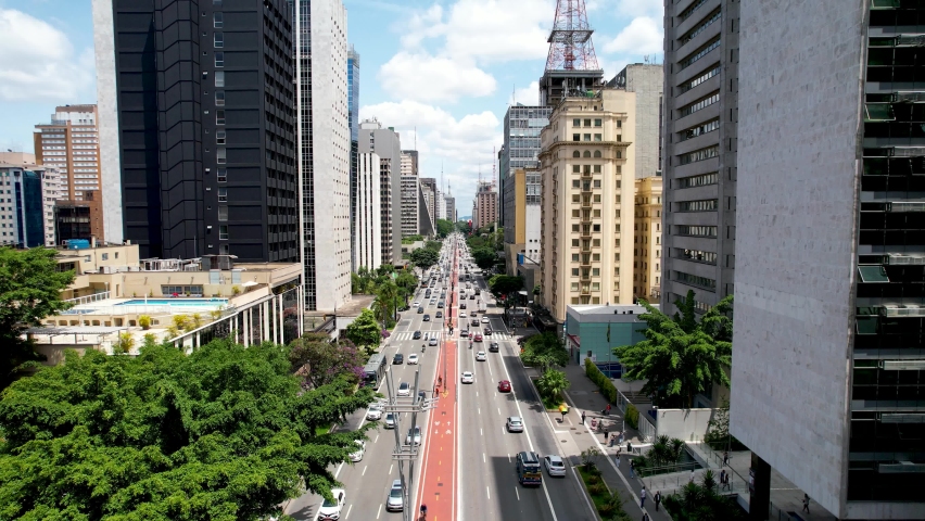 Top view of Paulista avenue at downtown Sao Paulo Brazil. Stunning landscape of landmark avenue of city. Urban aerials. Royalty-Free Stock Footage #1088007303