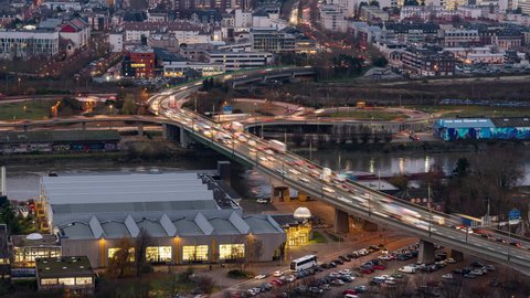 Rouen, France - December 15 2021: Timelapse of traffic at dusk crossing river Seine in Rouen