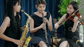 Classical band with girls Asian musicians are showing off their work online through social media.