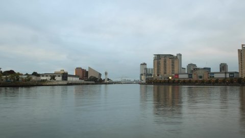 Manchester, UK. September 15, 2021: View on the river bridge of Manchester Ship Canal in Salford and Trafford, MediaCityUK buildings and facilities.