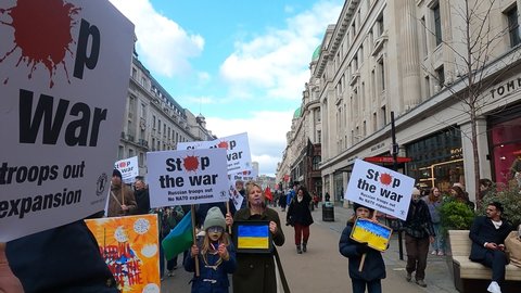 London, UK - 03 06 2022: London march support ukraine, invasion, colorful young pretty girls fuck putin
