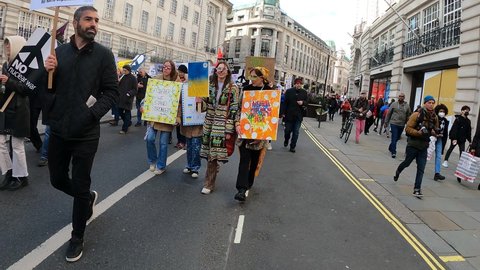 London, UK - 03 06 2022: colorful young pretty girls fuck putin London march support ukraine audio