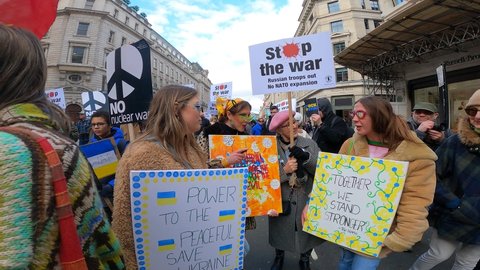 London, UK - 03 06 2022: London march support ukraine, invasion, colorful young pretty girls fuck putin