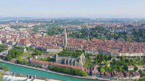 Inscription on video. Bern, Switzerland. Historic city center, general view, Are river. Arises from blue water, Aerial View