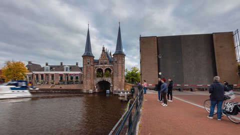 Sneek, Netherlands - 10 14 2021: Day Time Lapse with clouds and Gate Waterpoort in Sneek, Friesland, The Netherlands