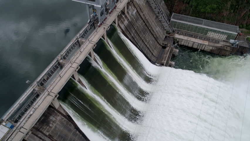 Aerial tilt side view of water discharge at hydroelectric power plant of Krasnoyarsk city, Siberia, Russia Royalty-Free Stock Footage #1088031373