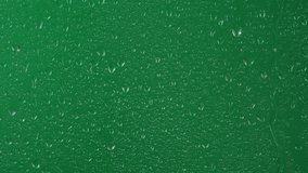Water rainfall, rain drops falling on window glass over chroma key green screen - Powered by Shutterstock - Get 15% off with code: PIKWIZARD15