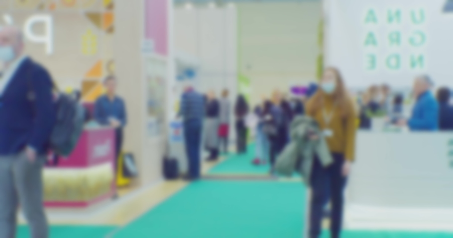 modern business life.defocused blurry video.background on a business theme with blurred silhouettes of unrecognizable people in a bright large hall.