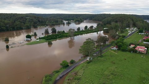 Sackville, NSW, Australia - March 9, 2022. Aerial view of the Hawkesbury River in flood in outer rural Sydney, Australia.