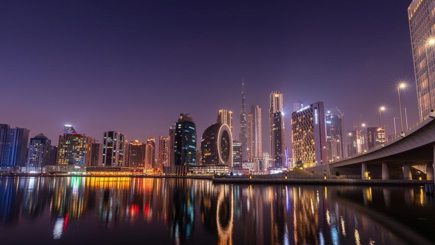 Dubai, United Arab Emirates - October 18 2021: Day to night time lapse of the skyline of Dubai seen from Business Bay