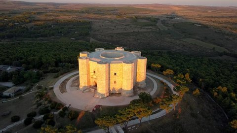 AERIAL: Castel del Monte, the famous castle built in an octagonal shape by the Holy Roman Emperor Frederick II in the 13th century in Apulia, Italy. World Heritage Site since 1996.