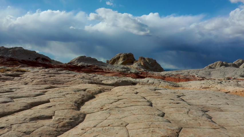 Low aerial shot of the amazing rocks and the landscape White Pockets, Vermilion Cliffs, in northern Arizona and southern Utah. Royalty-Free Stock Footage #1088056503