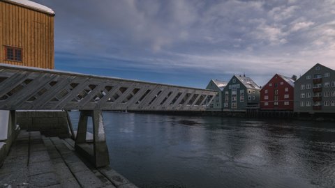Lateral View Of The Famous Old Town Bridge Crossing Nidelva River In Trondheim, Norway At Daytime. time lapse