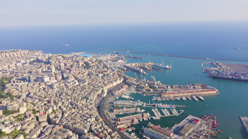 Inscription on video. Genoa, Italy. Central part of the city, aerial view. Ships in the port. Shimmers in colors purple, Aerial View