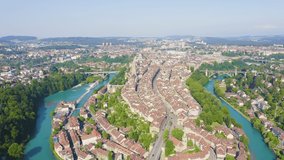 Inscription on video. Bern, Switzerland. Historic city center, general view, Aare river. Lightning strikes the letters, Aerial View