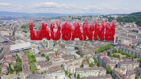 Inscription on video. Lausanne, Switzerland. Flight over the central part of the city. Flames with dark fire, Aerial View, Departure of the camera