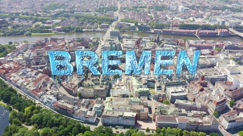 Inscription on video. Bremen, Germany. The historic part of Bremen, the old town. Bremen Cathedral ( St. Petri Dom Bremen ). View in flight. Arises from blue water, Aerial View, Departure of the came