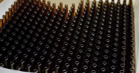 Clean beer bottles. Beer bottles in production and bottling. Technological line. factory concept. Glass recycling process, Recycled beer bottles in factory. conveyor belt at bottle factory