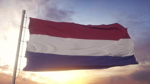 Netherlands Flag waving in the wind, sky and sun background
