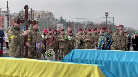 Lviv, Ukraine - March 9, 2022: Funerals of Ukrainian servicemen killed during Russia's invasion of Ukraine, at Lychakiv cemetery in city of Lviv. 