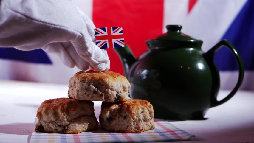 English traditional food of scones with teapot close up slow motion shot selective focus | Shutterstock HD Video #1088062729