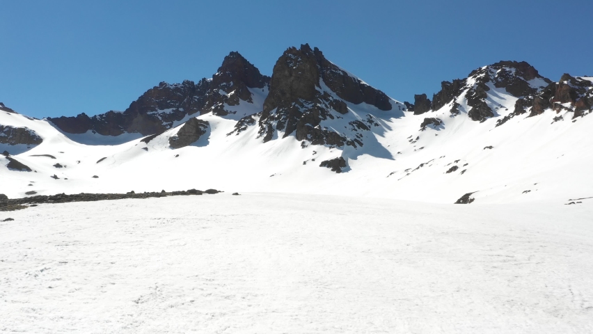 aerial view of mountains, aerial snow covered mountain peaks in alps in winter