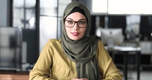 muslim woman university student at campus library