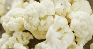 Video of close up of florets of fresh cauliflower. fusion food, fresh vegetables and healthy eating concept.