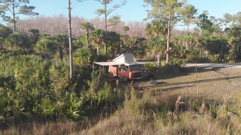 everglades , fl , United States - 03 04 2022: volkswagen vanagon westfalia campervan camping campground everglades forest grass vanlife aerial drone