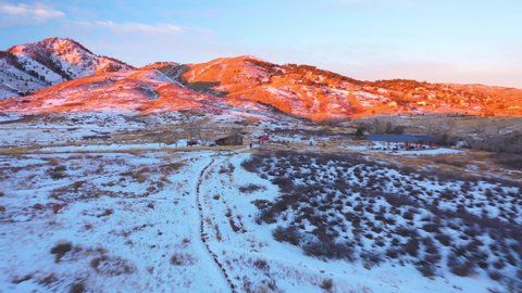 Aerial video of mountains in Boulder, CO. Red Rocks in Winter Colorado Snow Covered.