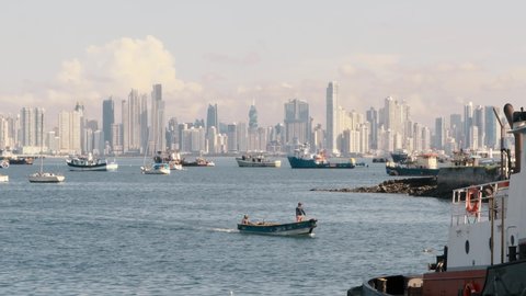 Panoramic view overlooking the boats moored in the Panama Canal marina, in the distance a scenic backdrop of the spectacular modern buildings and beautiful cityscape of Panama City