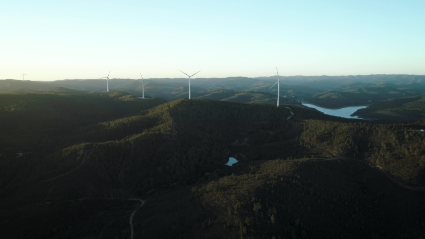 Aerial view windmill farm in the Portugal countryside producing sustainable clean energy | Shutterstock HD Video #1088069957