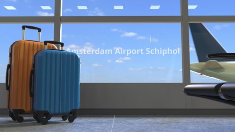 Terminal and commercial aeroplane revealing Amsterdam airport Schiphol text