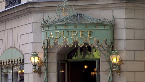 Paris, France - May 2019 : Facade of the Ladurée flagship shop on the Champs-Elysees avenue in Paris, France