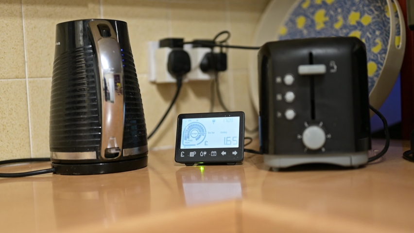 Slow push in towards a smart meter between a kettle and a toaster Royalty-Free Stock Footage #1088082151