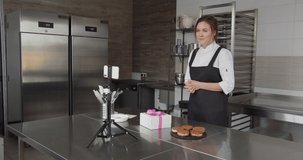 A professional chef conducts a master class and flips through the touch screen
