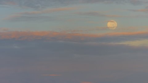 moon time lapse, moonlight, clouds and moon, sunrise sky. Motion blur. Noise. Blurred. Selective focus.